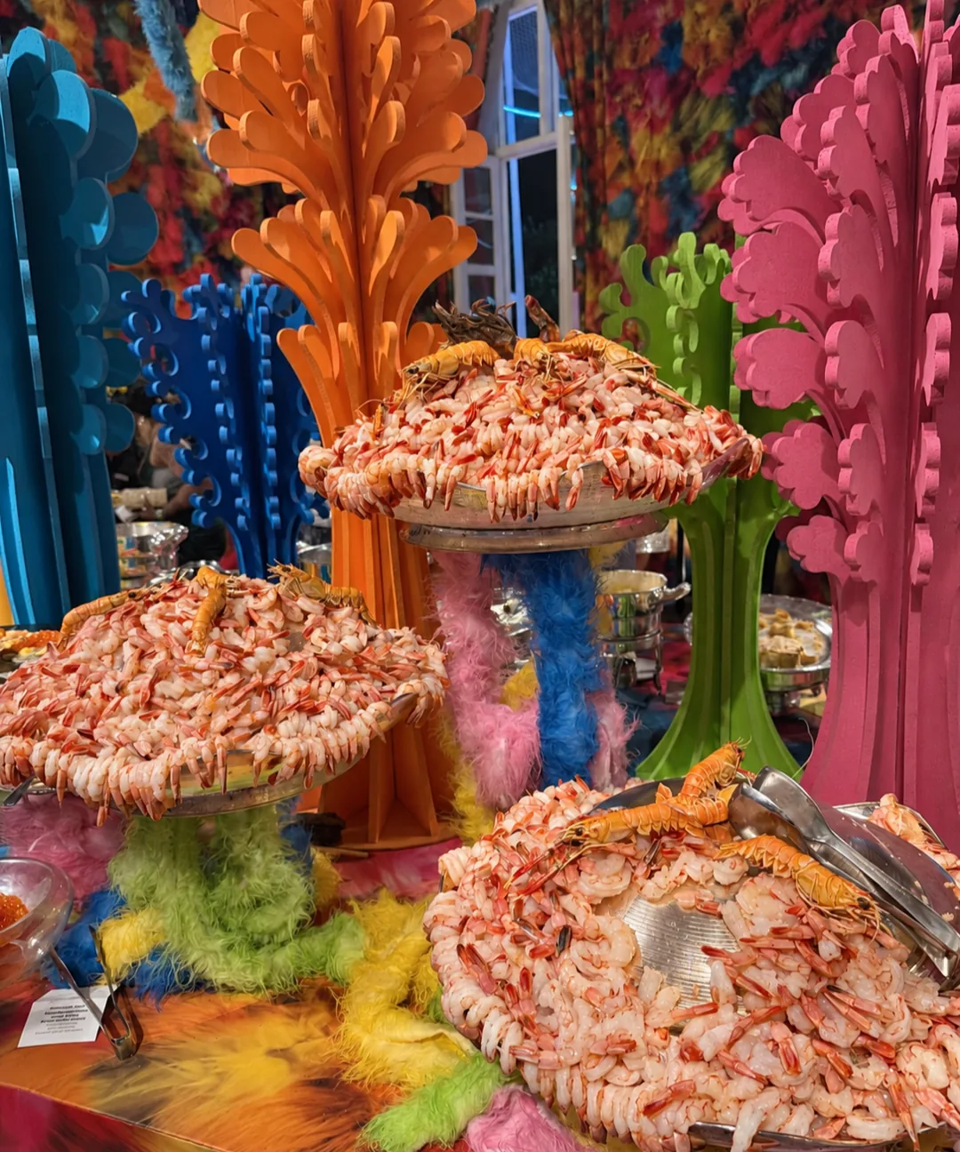 Chilled shrimp displayed on tiered platters among coral-shaped decor at the Copa Ball buffet