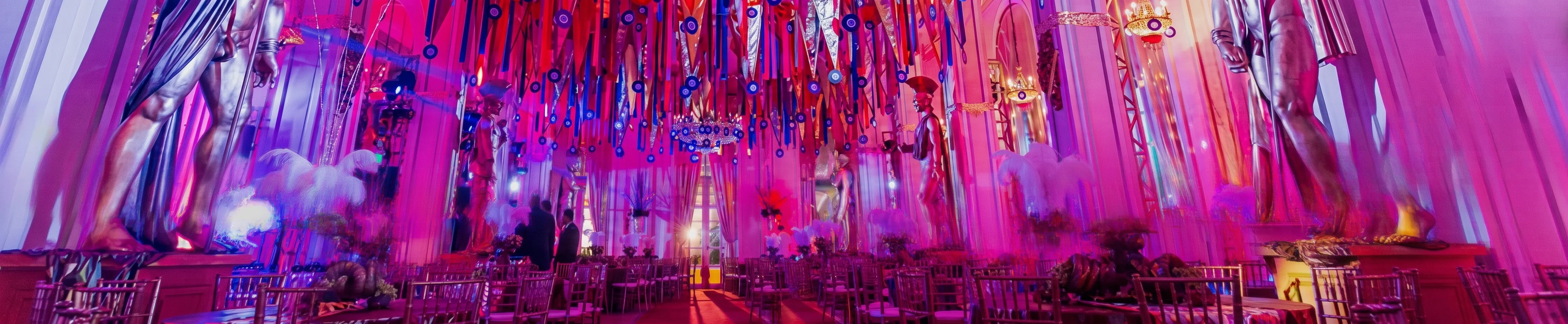 Colourful ceiling drapes and gold statues decorating the Copacabana Palace ballroom