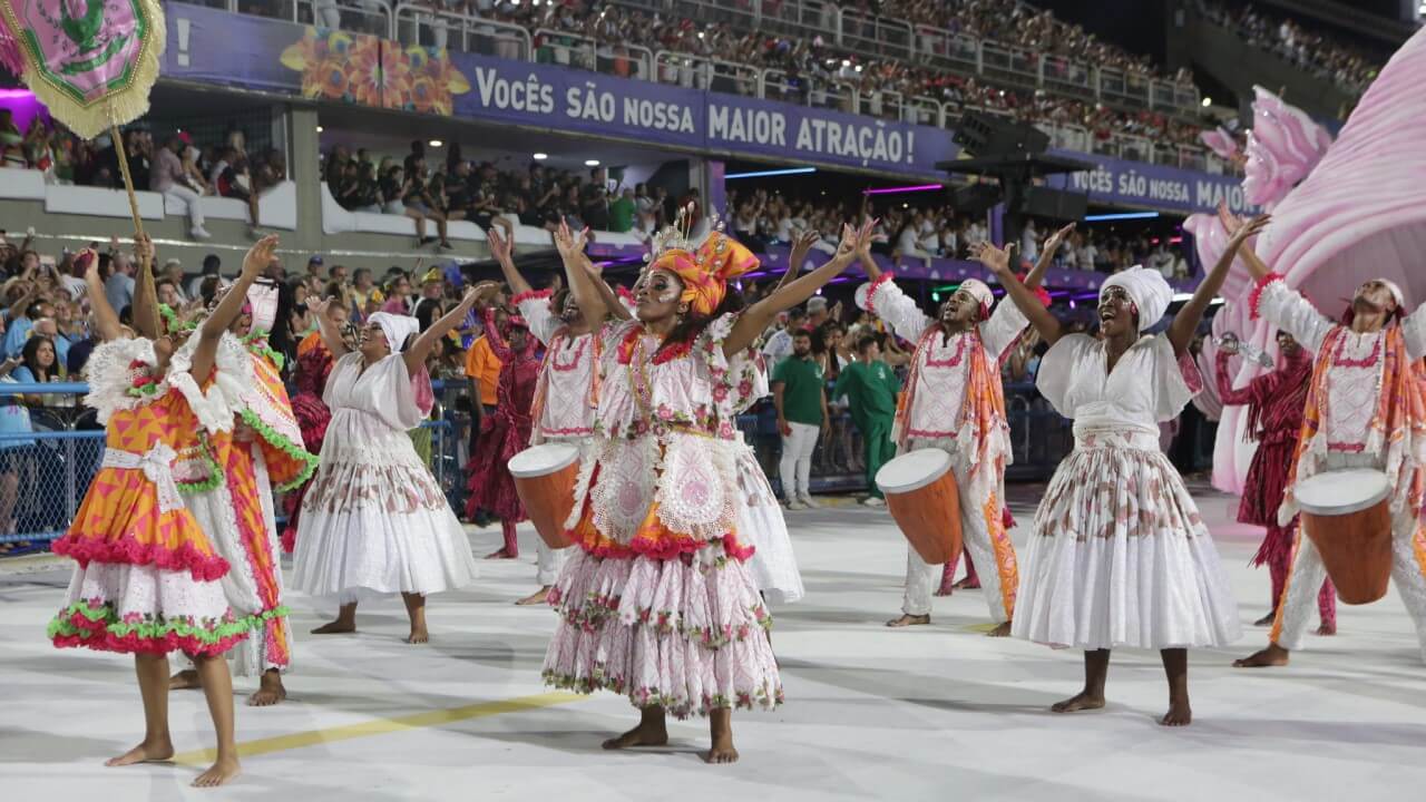 Cheerful people parading in a samba school costume - Rio Carnival